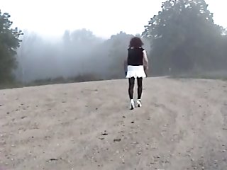 Crossdresser on a dirt road