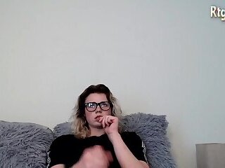 petite shemale cutie in  glasses stroking her big cock until she cum shottting