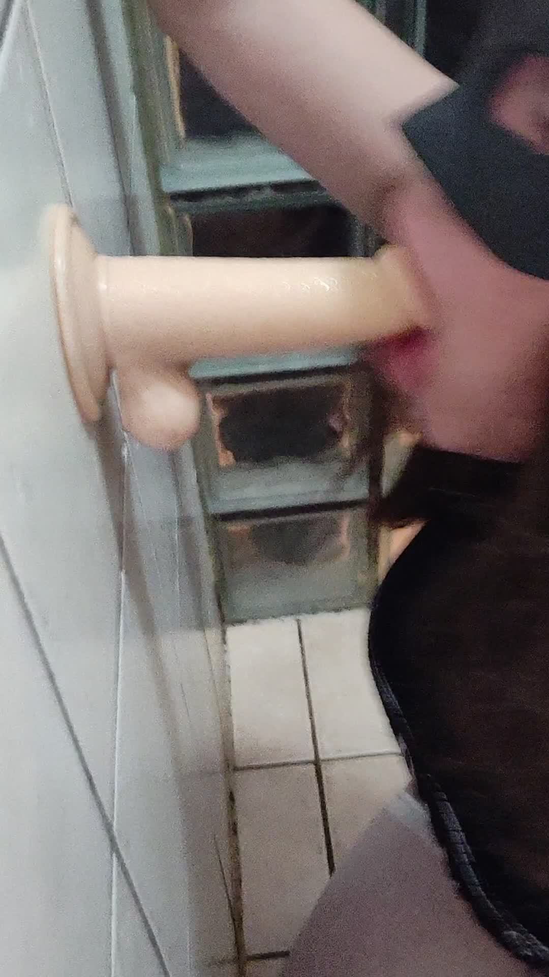 Young crossdresser sucking dildo